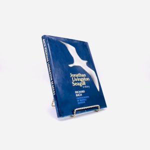 Jonathan Livingston Seagull. Inscribed by Richard Bach. Photographs by Russell Munson. First Edition, First Printing. Macmillan. New York, 1970.