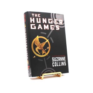 The Hunger Games. Warmly Inscribed by Suzanne Collins. First Edition, Second Printing. Scholastic. New York, 2008.