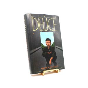 The Deuce. Signed by Robert Olen Butler. First Edition, First Printing. Simon & Schuster. New York, 1989.